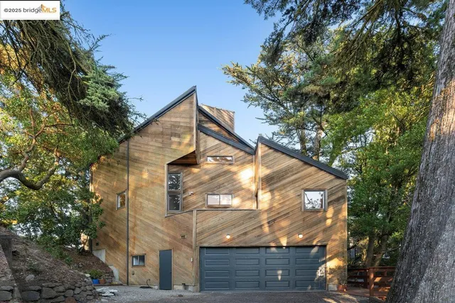 a view of a house with a tree