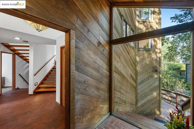 a view of staircase with wooden floor and stairs