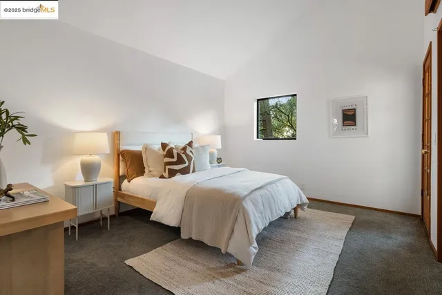 a bathroom with a sink mirror and toilet