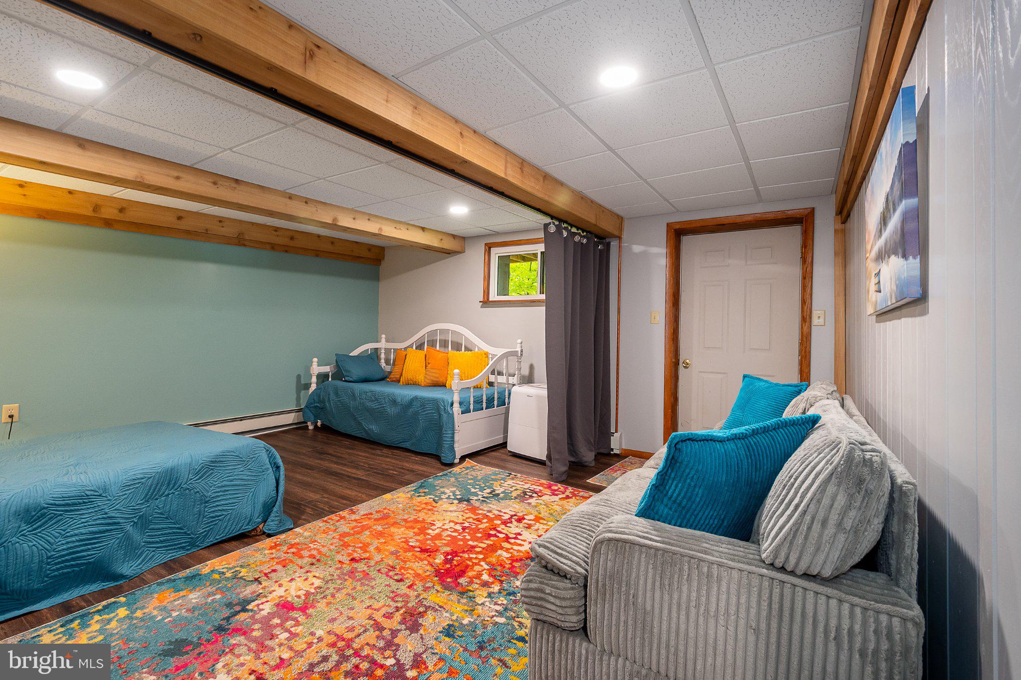 750 Lake Side Road Addison, PA 15411 - Photo 44 of 51 Cozy basement retreat with vibrant decor.