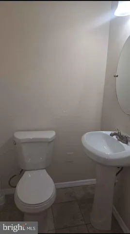 a bathroom with a toilet and a sink