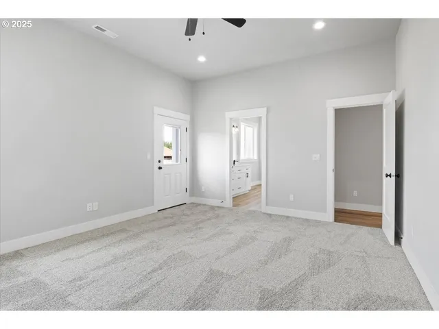 a bathroom with a sink mirror and shower