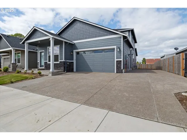 a kitchen with cabinets and stainless steel appliances