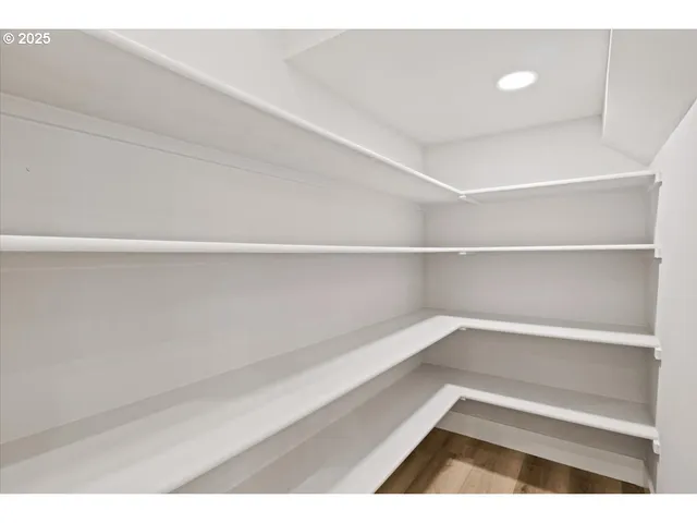 a kitchen with a sink cabinets and stainless steel appliances