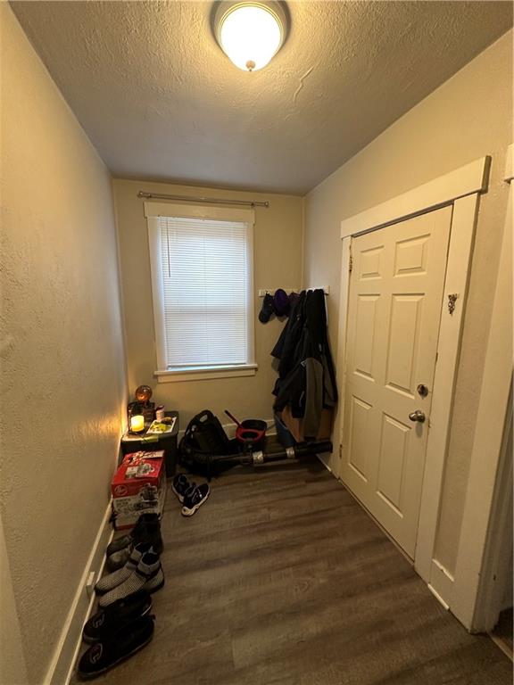 1131 12th Street McKees Rocks, PA 15136 - Photo 11 of 45 a room with wooden floor and gym equipment