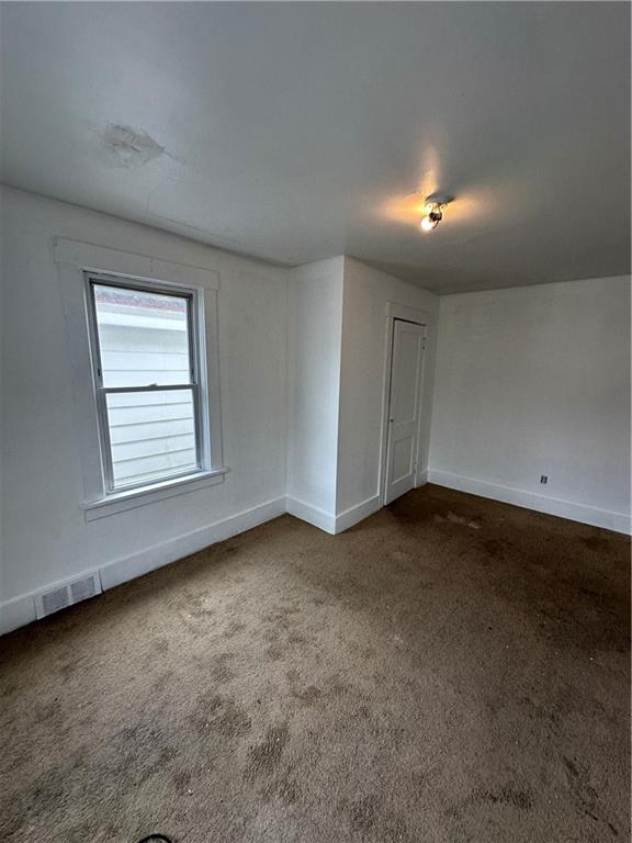 1131 12th Street McKees Rocks, PA 15136 - Photo 35 of 45 an empty room with a empty space and windows