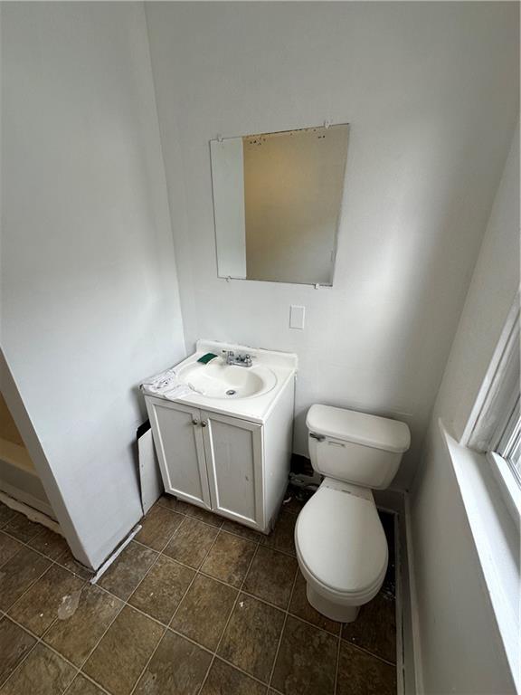 1131 12th Street McKees Rocks, PA 15136 - Photo 38 of 45 a bathroom with a toilet sink and mirror