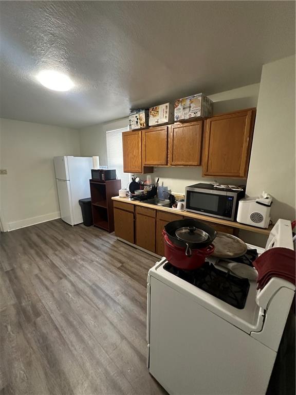 1131 12th Street McKees Rocks, PA 15136 - Photo 4 of 45 a kitchen with a stove and a microwave