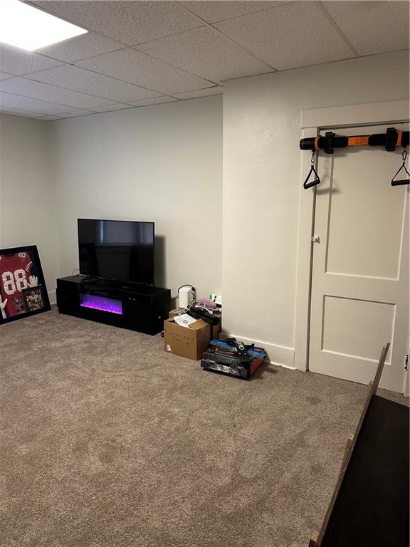 1131 12th Street McKees Rocks, PA 15136 - Photo 6 of 45 a living room with furniture gym equipment and a flat screen tv