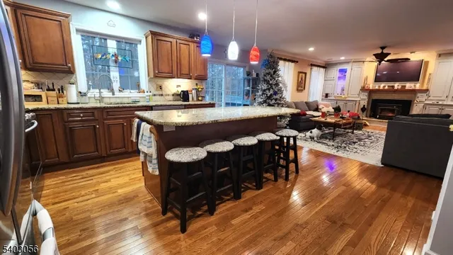 a kitchen with center island and stainless steel appliances