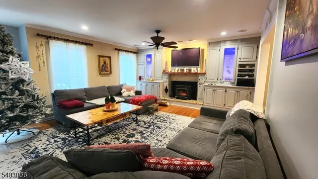 a living room with fireplace furniture and a flat screen tv