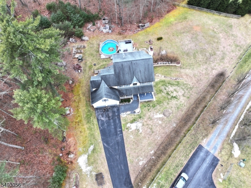 52 Fox Hollow Road Montague, NJ 07827 - Photo 2 of 45 a backyard of a house with table and chairs