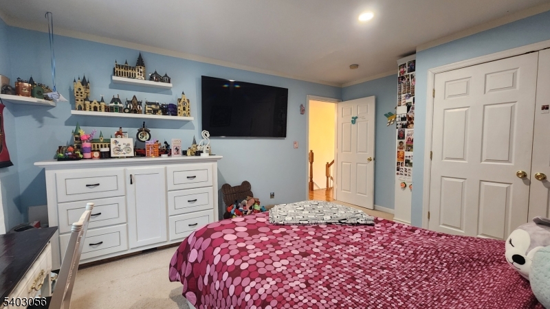 52 Fox Hollow Road Montague, NJ 07827 - Photo 35 of 45 a bedroom with a bed dresser and a flat screen tv