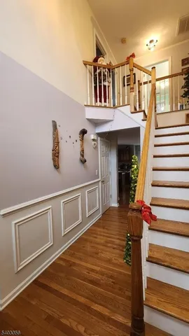a living room with furniture cabinets and window