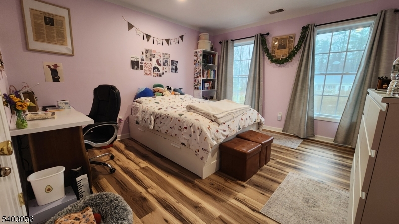 52 Fox Hollow Road Montague, NJ 07827 - Photo 42 of 45 a bedroom with a bed and wooden floor