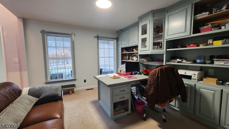 52 Fox Hollow Road Montague, NJ 07827 - Photo 6 of 45 a view of a workspace with furniture and a bookshelf