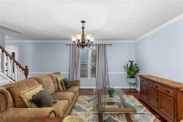 a kitchen with stainless steel appliances a stove a sink refrigerator and a microwave