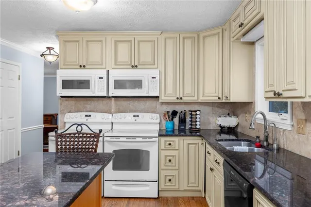 a view of a hallway with wooden floor and stairs