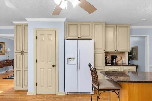 a view of entryway with livingroom and wooden floor