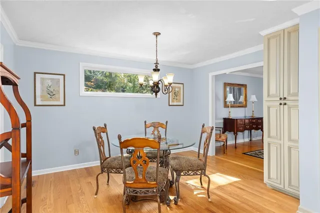 a bathroom with a double vanity sink a mirror and a bathtub