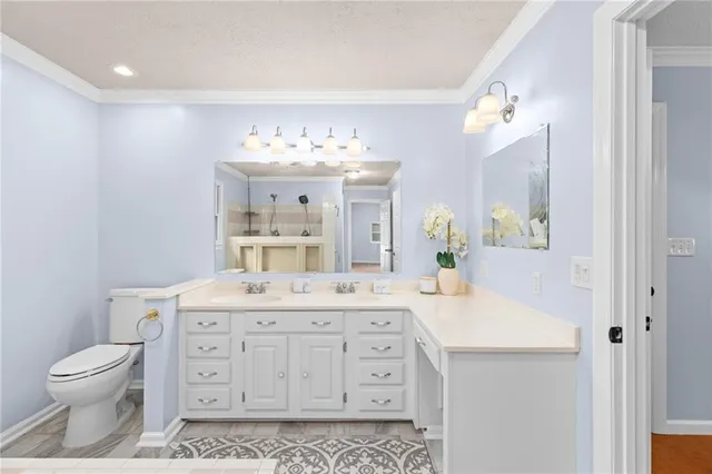 a view of a lake with houses in the background