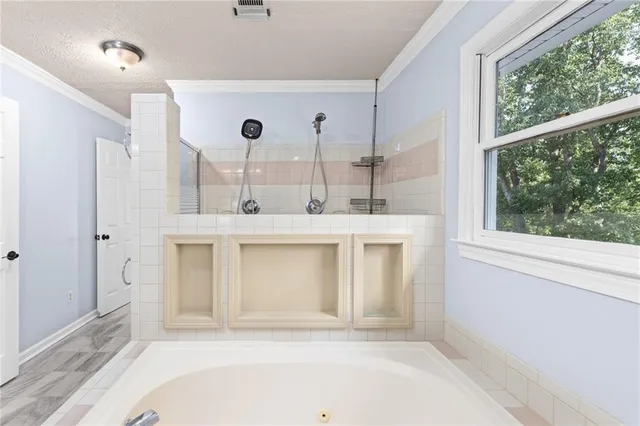 an aerial view of a house with swimming pool and garden