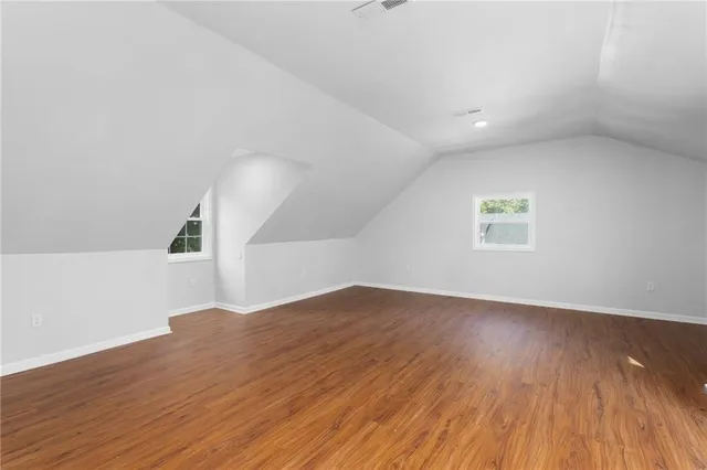 an aerial view of a house with a yard basket ball court and outdoor seating