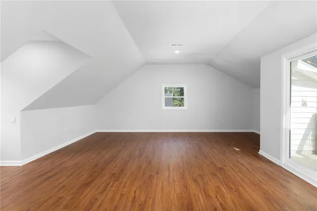 an aerial view of a house with a yard swimming pool and outdoor seating