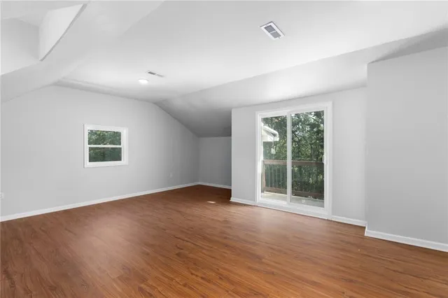 an aerial view of a house with a lake view