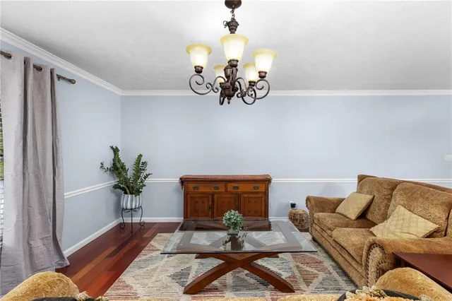 a kitchen with stainless steel appliances white cabinets and a window