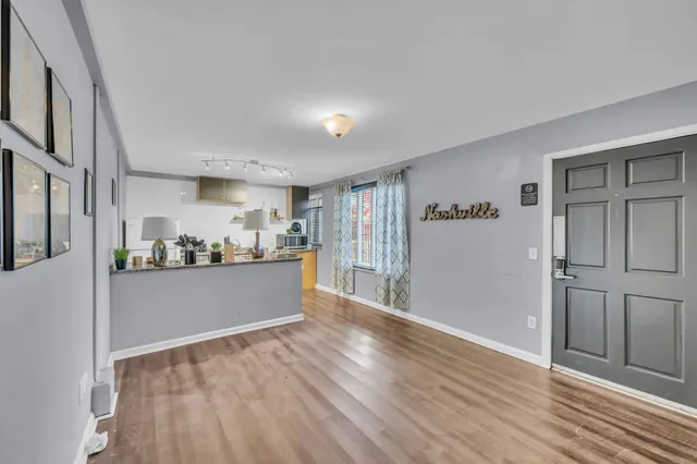 a view of livingroom with hardwood floor and hallway