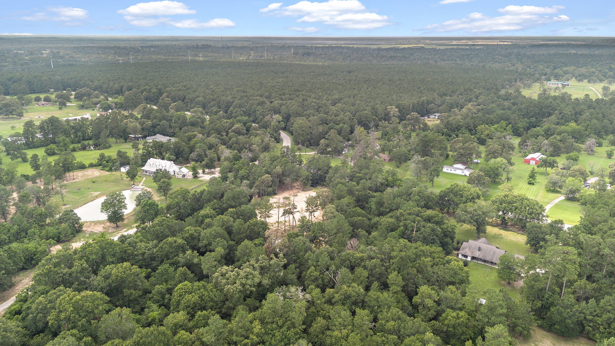 28171 Joseph Road Hockley, TX 77447 - Photo 21 of 28 a view of a lake from a yard