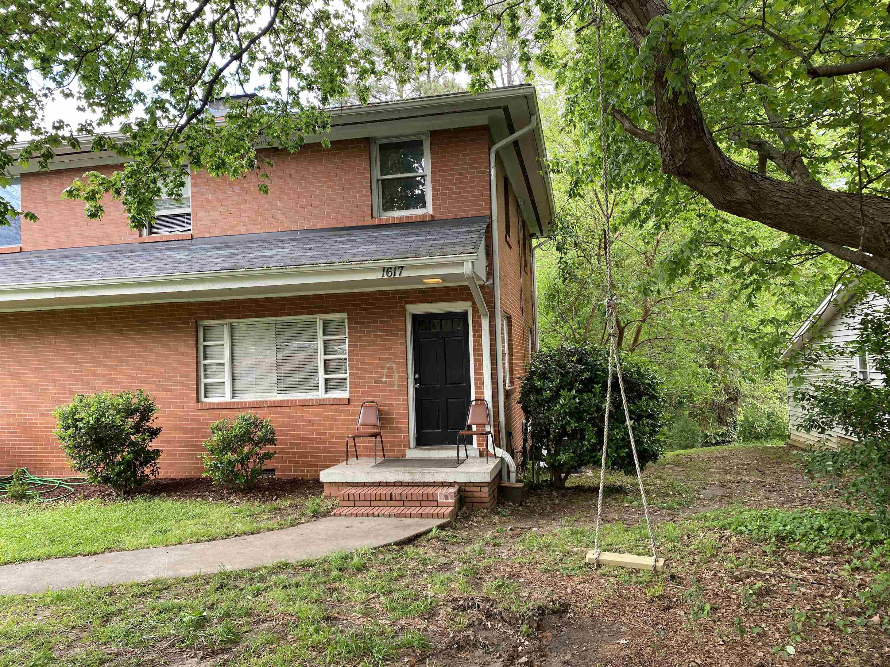 1613 Honeysuckle Road Raleigh, NC 27609 - Photo 13 of 24 a front view of a house with garden