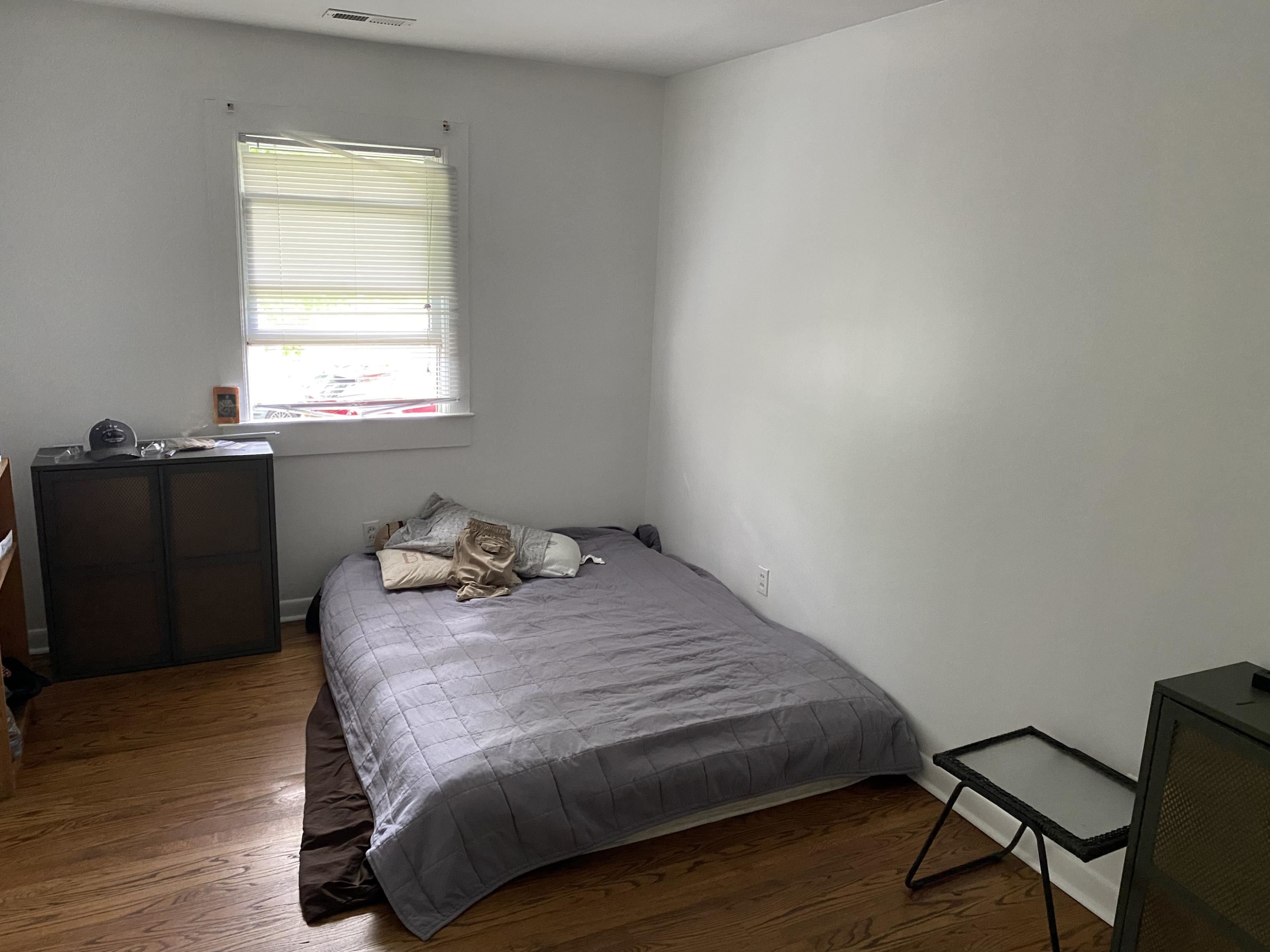1613 Honeysuckle Road Raleigh, NC 27609 - Photo 19 of 24 a bedroom with a bed and a window
