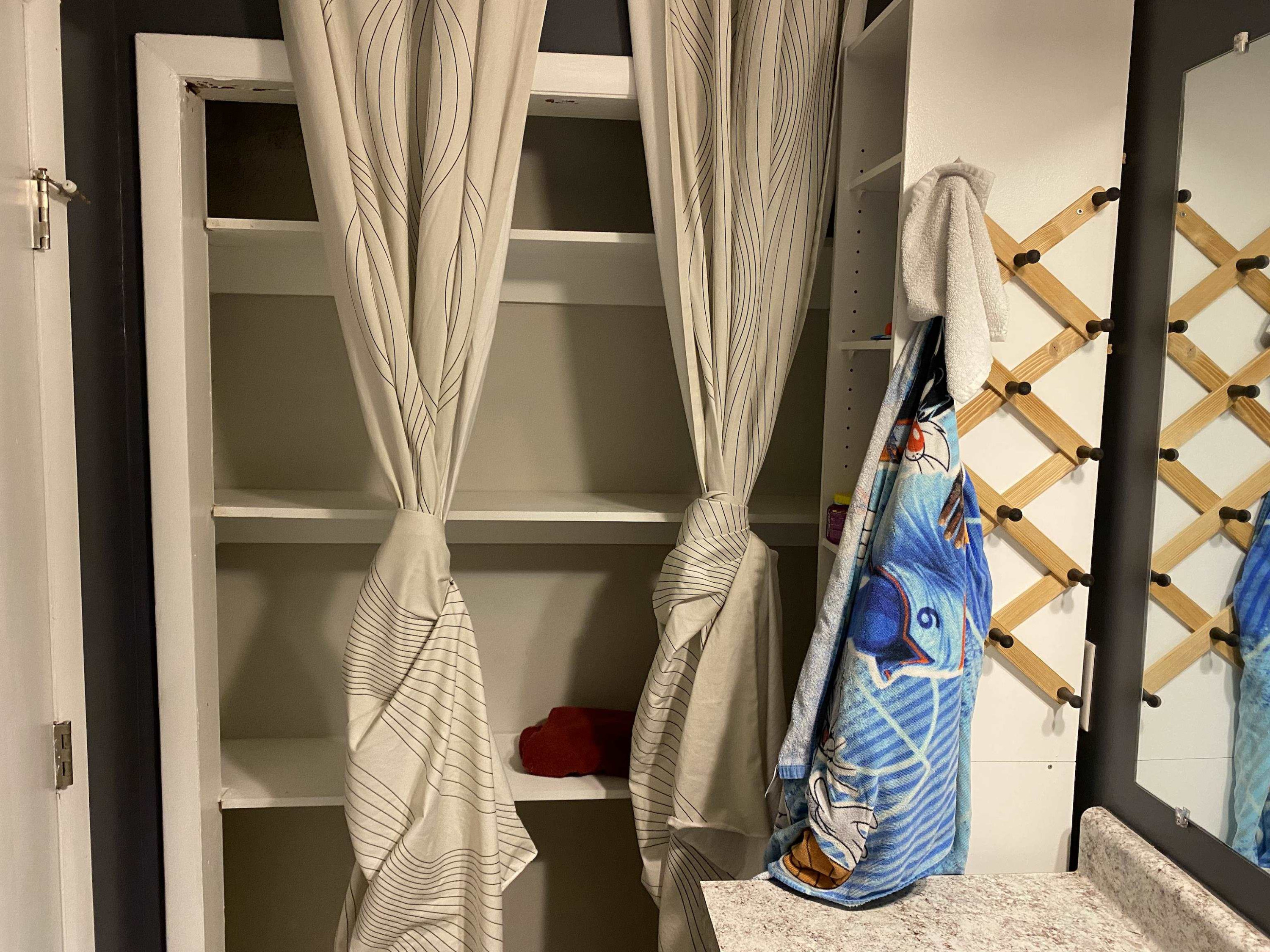 1613 Honeysuckle Road Raleigh, NC 27609 - Photo 22 of 24 a view of walk in closet with clothes and shoes