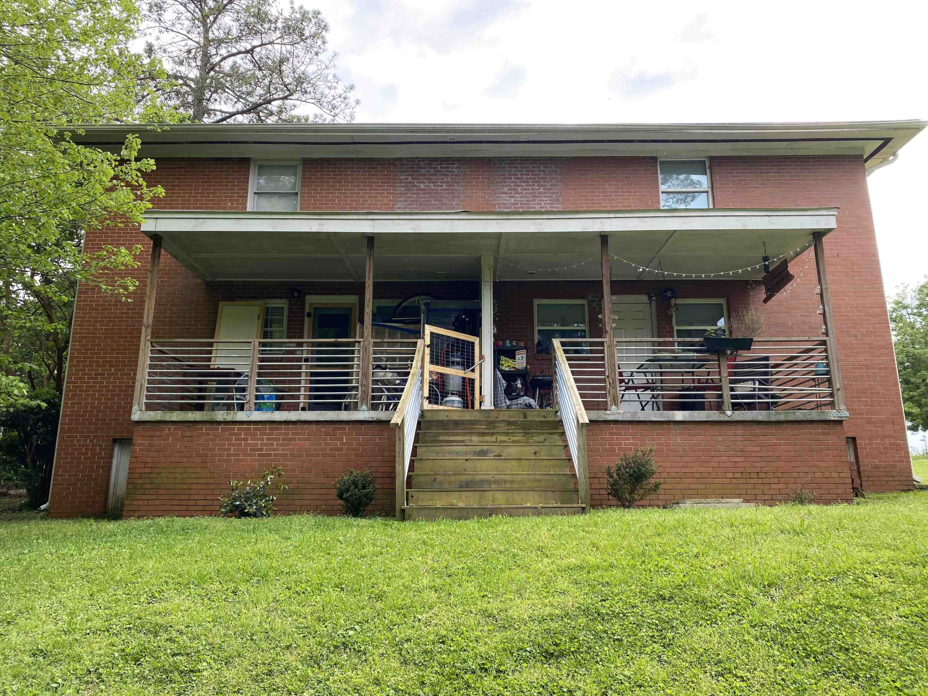 1613 Honeysuckle Road Raleigh, NC 27609 - Photo 23 of 24 a front view of a house with garden