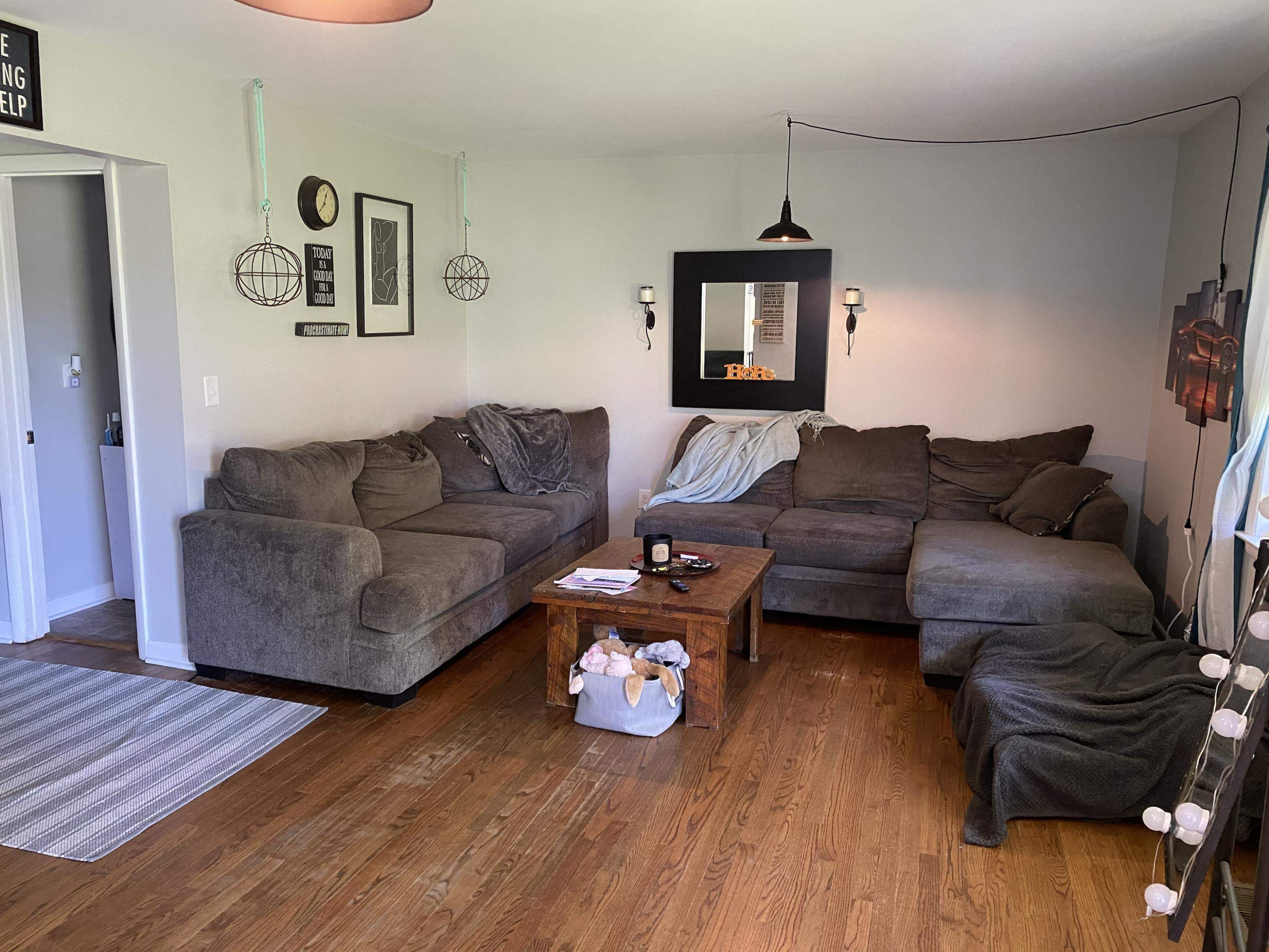 1613 Honeysuckle Road Raleigh, NC 27609 - Photo 4 of 24 a living room with furniture and a wooden floor