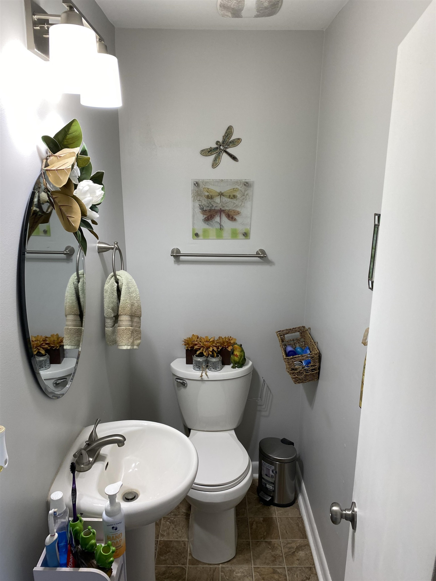 1613 Honeysuckle Road Raleigh, NC 27609 - Photo 7 of 24 a bathroom with a toilet a sink and mirror