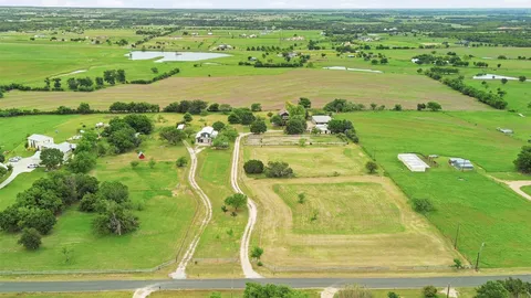 a view of a golf course with a building in the background