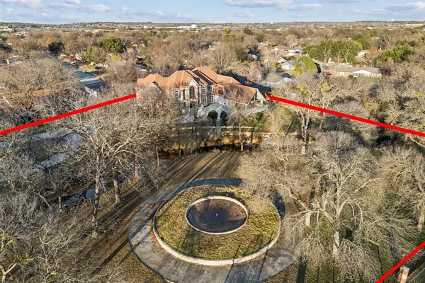 a view of a houses with a small yard and mountain view