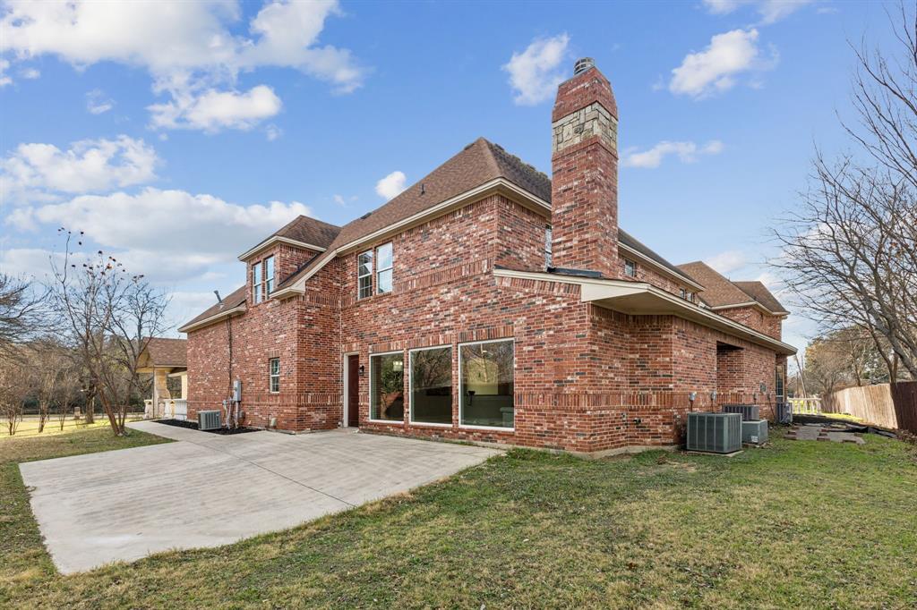 469 Apache Trail Keller, TX 76248 - Photo 33 of 39 a front view of a house with a garden