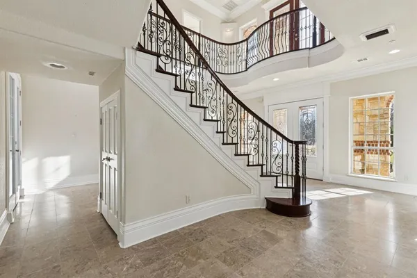 a view of an entryway with wooden floor