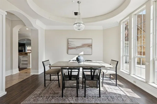 a living room with furniture a fireplace and a ceiling fan