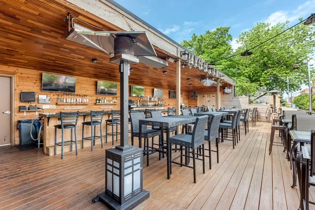 a view of a dining space with furniture and wooden floor