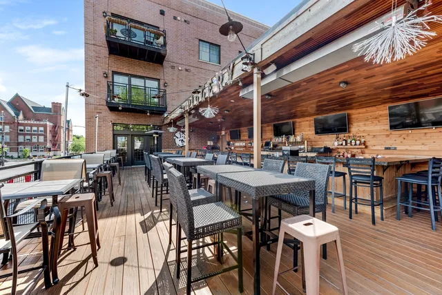 a living room with lots of furniture and a flat screen tv