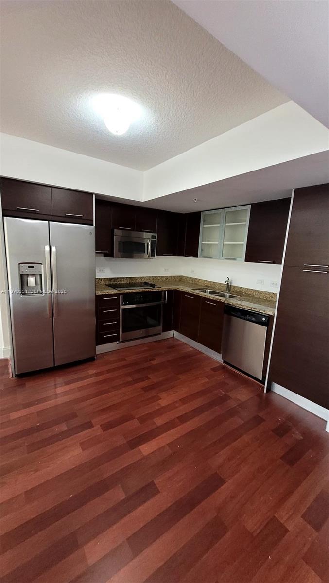 a room with wooden floor and furniture