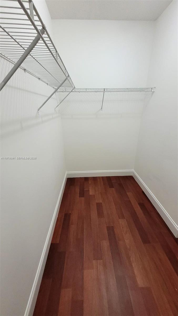 41 Southeast 5th Street, Unit 709 Miami, FL 33131 - Photo 17 of 17 a view of a room with wooden floor