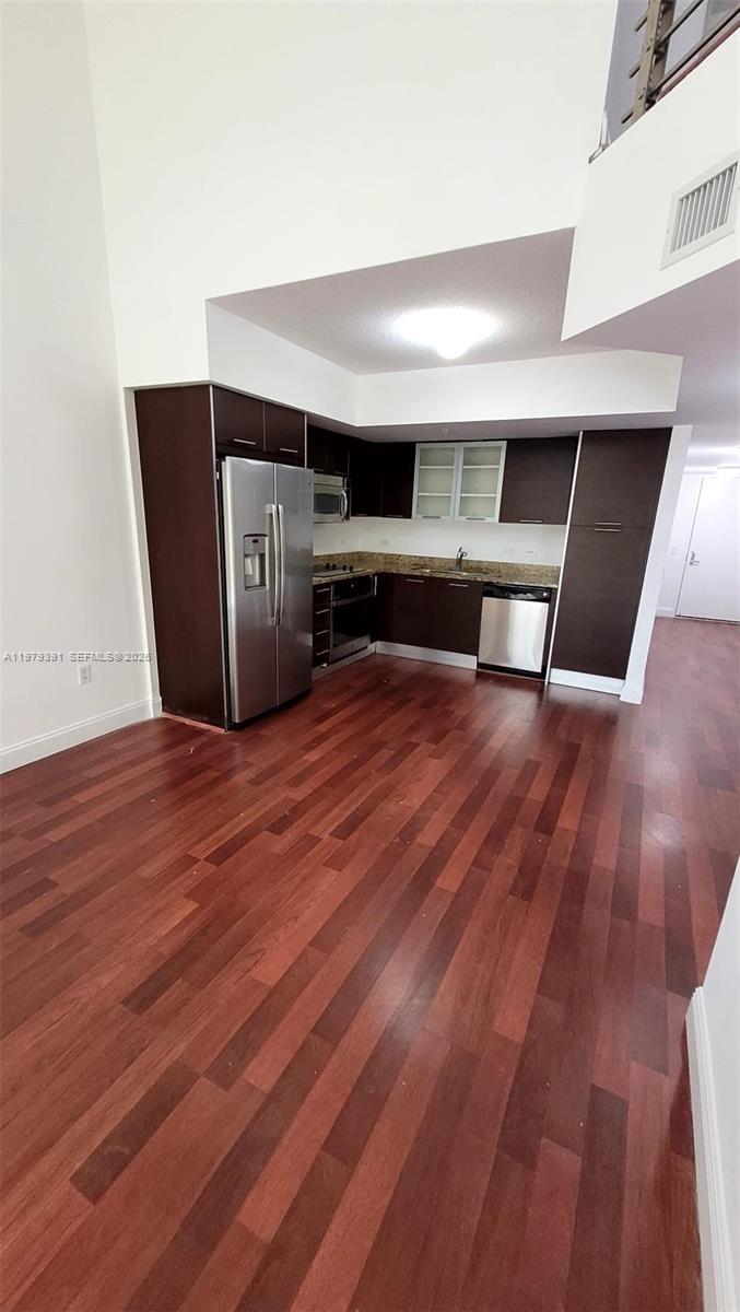 41 Southeast 5th Street, Unit 709 Miami, FL 33131 - Photo 2 of 17 a view of livingroom with furniture and wooden floor