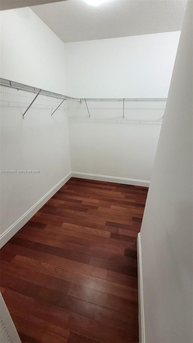 41 Southeast 5th Street, Unit 709 Miami, FL 33131 - Photo 8 of 17 a view of a room with racks on the wall