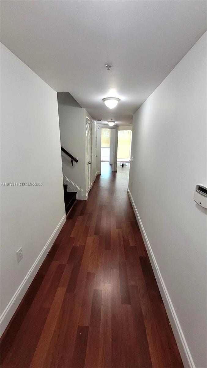 41 Southeast 5th Street, Unit 709 Miami, FL 33131 - Photo 9 of 17 a view of a hallway with wooden floor